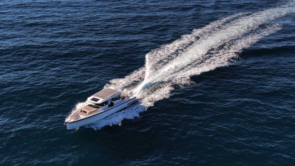 The yacht Calypso speeding in the sea