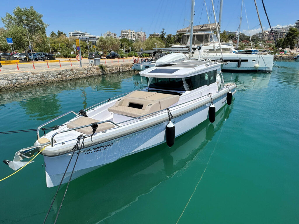 Front-side view of the Calypso yacht docked at Alimos marina