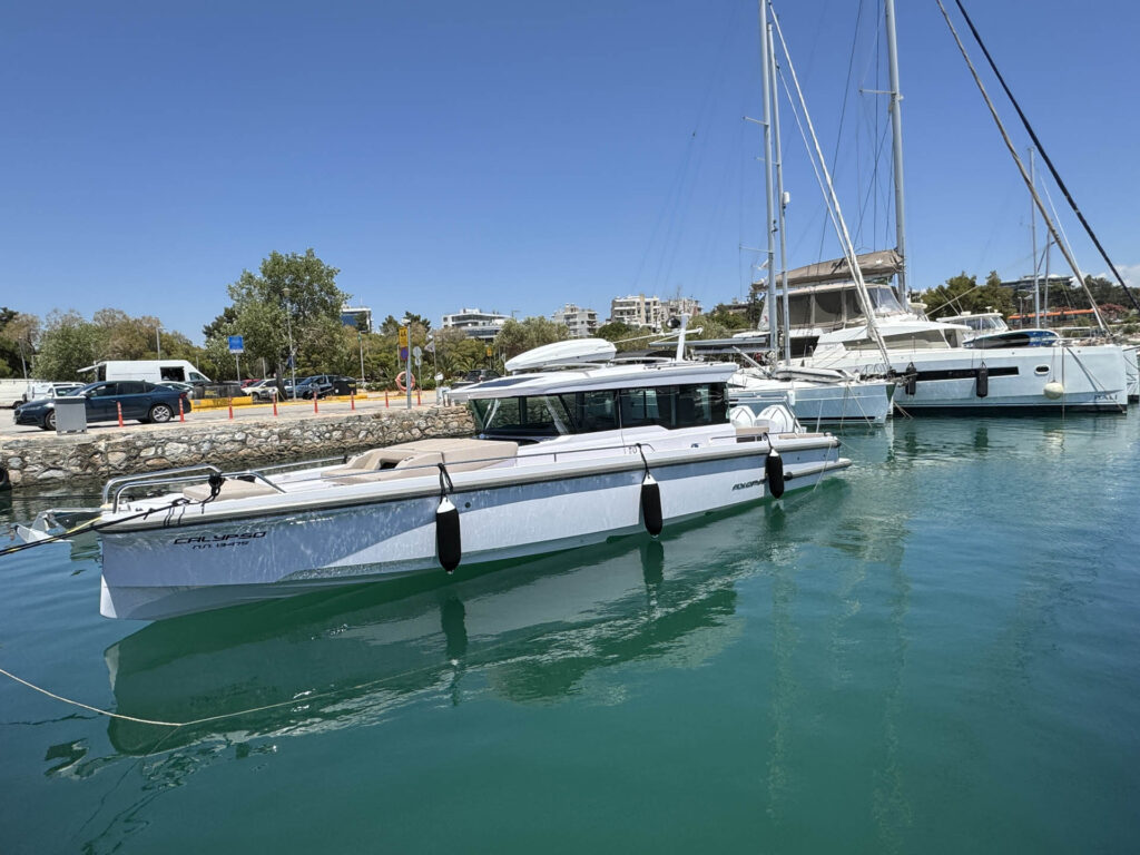 Side view of the Calypso yacht docked at Alimos marina