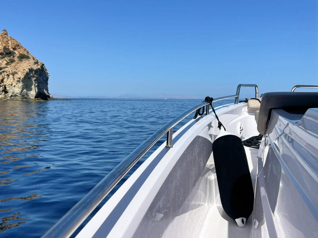 Side view of the Calypso bow with rocky island on the left